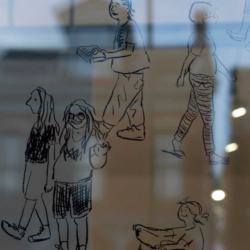 Photograph of drawings on front gallery window