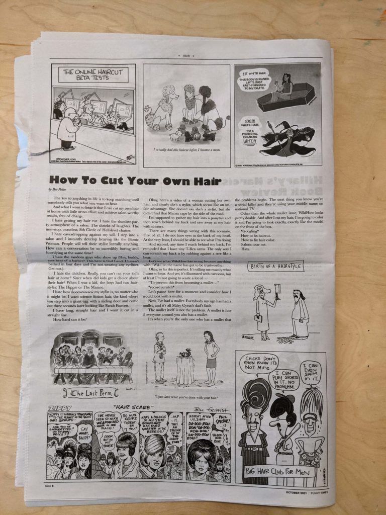 Photograph of a full page of a newspaper, with Theora's cartoon of poodles in the top center.